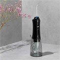Ирригатор для полости рта REVYLINE RL 450 New, портативный, емкость резервуара 0,3 л, 5 насадок, черный, 7993 457240